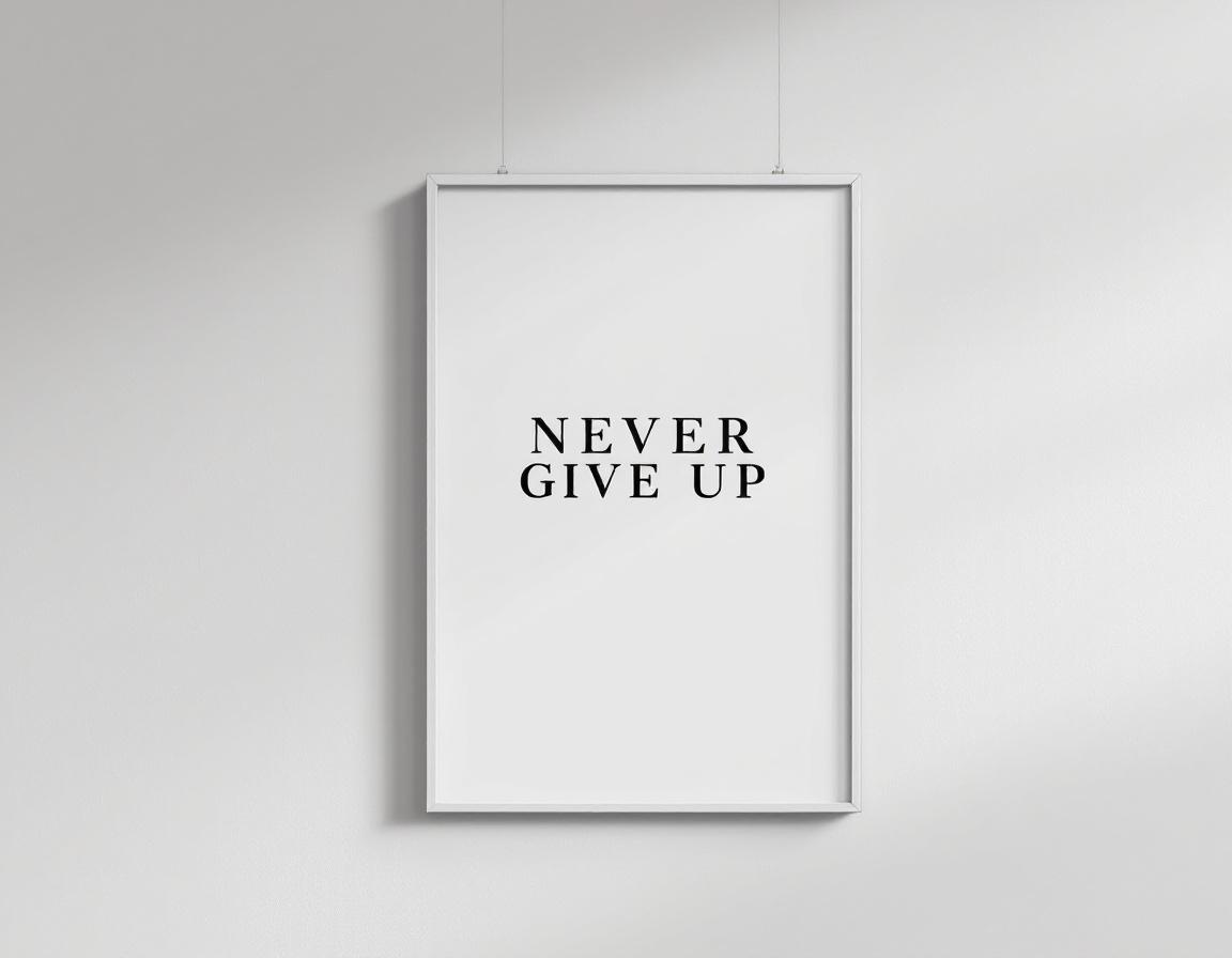 A framed wall poster with text "NEVER GIVE UP" centered in bold black modern font, white background